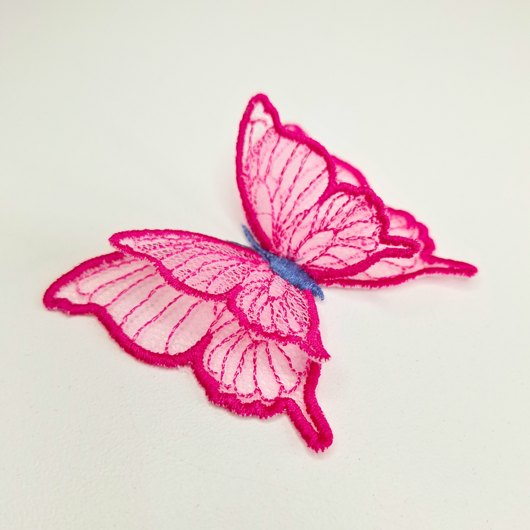 This is an image of a 3D Freestanding Tulle Butterfly. This 3D Tulle Butterfly is a downloadable machine embroidery design from Stitches & Strokes. This butterfly machine embroidery design fits a 4x4 inch machine embroidery hoop. Our 3D butterfly is easy to make and suitable for both beginner and advanced embroiderers.