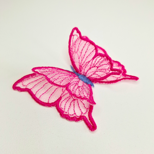 This is an image of a 3D Freestanding Tulle Butterfly. This 3D Tulle Butterfly is a downloadable machine embroidery design from Stitches & Strokes. This butterfly machine embroidery design fits a 4x4 inch machine embroidery hoop. Our 3D butterfly is easy to make and suitable for both beginner and advanced embroiderers.