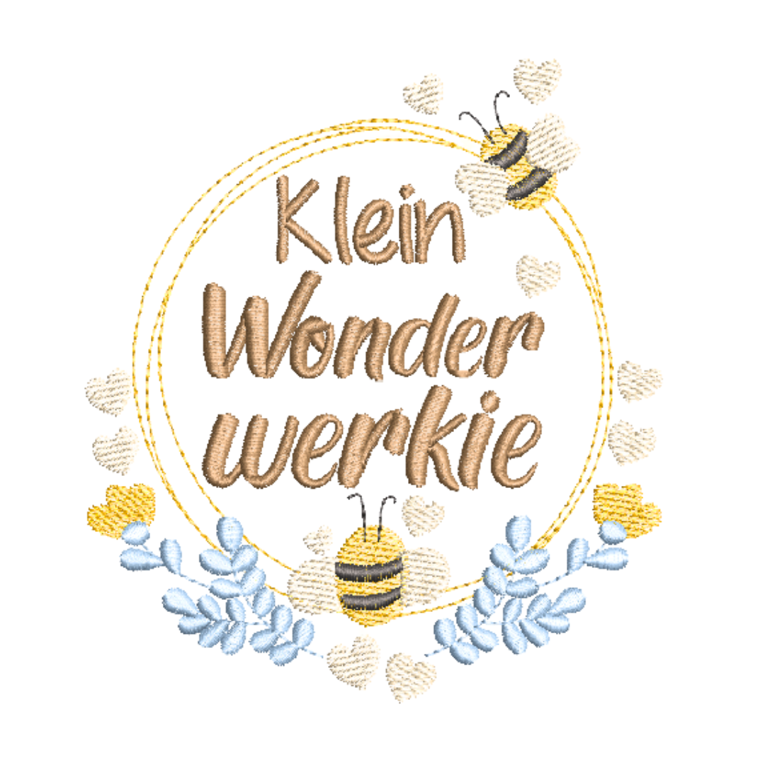 This is an image of a machine embroidery design by Stitches & Strokes, featuring an Afrikaans saying "Klein Wonderwerkie, surrounded by a wreath adorned with cute bees and flowers in yellows and blue.