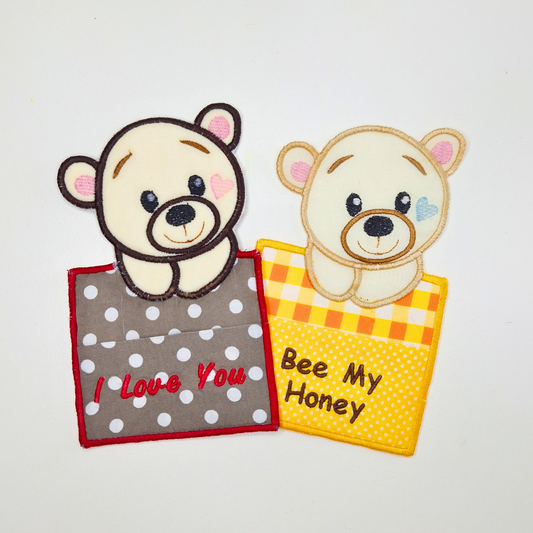 This is an image of an Applique Bear Gift Card Holder Machine Embroidery Design that you can embroider in a variety of colors. This gift card holder is perfect for gifting on Valentine's Day and Baby Showers