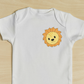 This is an image of a cute but simple lion face machine embroidery design embroidered on a baby onesie.