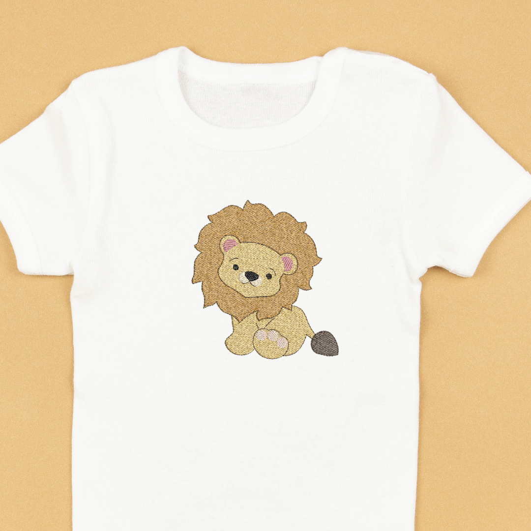 This is an image of a machine embroidery design featuring a cute baby lion. This safari themed machine embroidery design is perfect for embroidery on baby shower gift items like baby onesies and blankets.