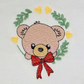 Baby Bear With Red Bow In Wreath Machine Embroidery Design