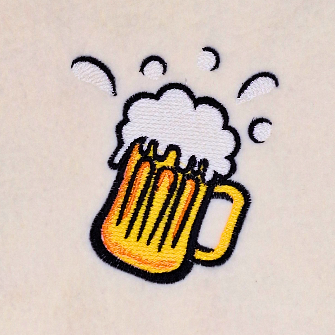 This is an image of a machine embroidery design featuring a frothy beer mug. This Beer Mug machine embroidery design is perfect for embroidery on t-shirts, aprons, bar towels, and more. The Beer Mug machine embroidery design will make ideal gifts for Father's day, Birthdays, and Christmas, and will make any Beer Lover's Day.