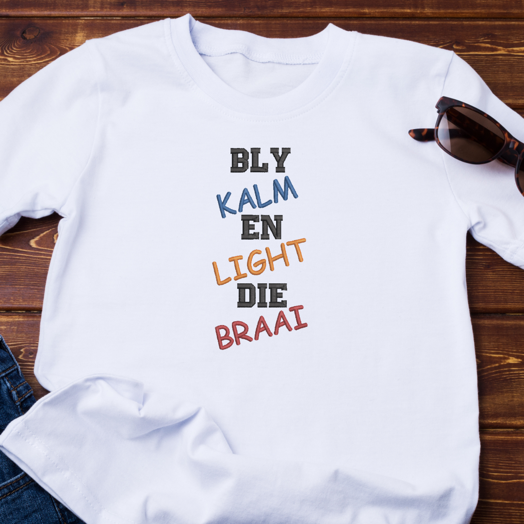 This is an image of a machine embroidery design featuring an Afrikaans Quote "Bly Kalm En Light die Braai." This Afrikaans quote machine embroidery design is perfect for embroidery on aprons, t-shirts, and accessories for men on Birthdays and Father's Day.