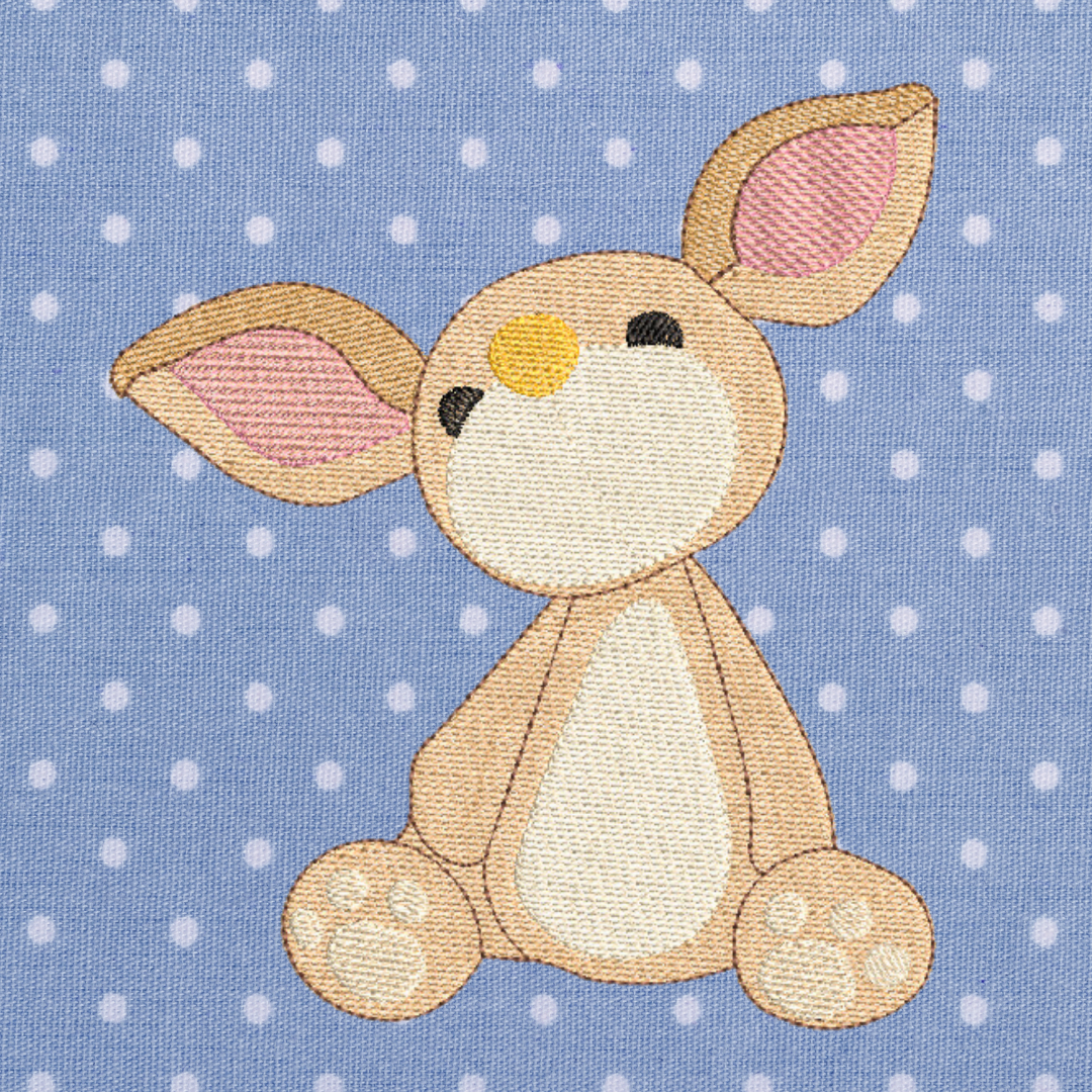 This is an image of a baby bunny with big ears machine embroidery design. This bunny machine embroidery design can be embroidered on baby clothes and onesies for Easter, Baby Showers, and more.