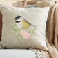 This is an image of a machine embroidery design by Stitches & Strokes, featuring a cute little Chickadee Bird on a branch with leaves and pink flowers. The Chickadee Bird Embroidery Pattern has intricate feather detail and will add exquisite detail to any item it is embroidered on.