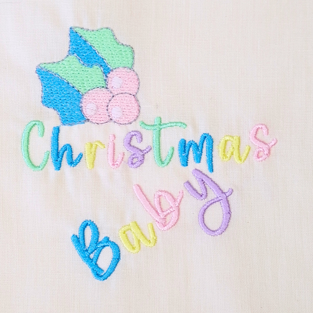 This is an image of a Christmas Newborn baby machine embroidery design in baby pastel colors