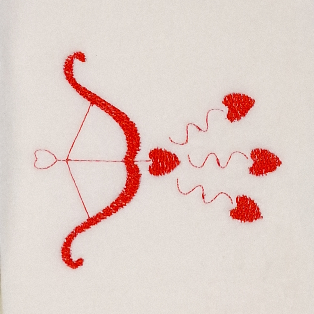 This is an image of a Cupid's Bow Shooting Hearts machine embroidery design.