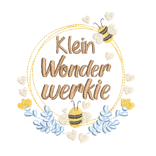 This is an image of a machine embroidery design by Stitches & Strokes, featuring an Afrikaans saying "Klein Wonderwerkie, surrounded by a wreath adorned with cute bees and flowers in yellows and blue.