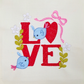 This is a machine embroidery design featuring a Love Sign with adorable blue birds, and is detailed with twigs, flowers and a pink bow. This machine embroidery design is perfect for embroidery on gifts for Valentine's Day.