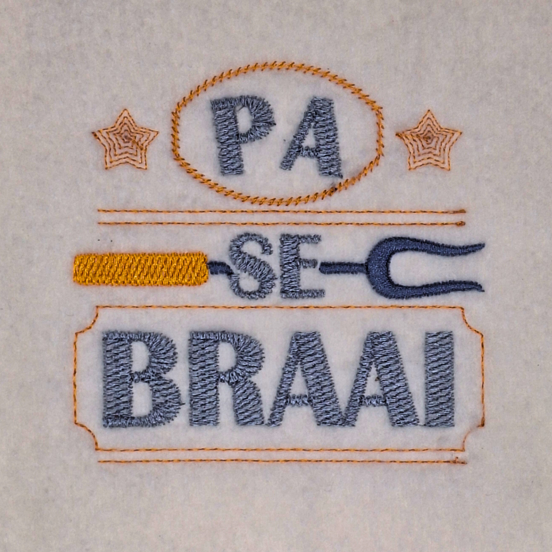 This is an image of a machine embroidery design by Stitches & Strokes, featuring an Afrikaans Quote: "Pa Se Braai". This Afrikaans quote machine embroidery design is perfect for embroidering on Aprons, Braai Towels, and Grilling Accessories for dad, and will make the ideal gift for dad who loves to Grill on Father's Day, Birthdays, and Christmas.