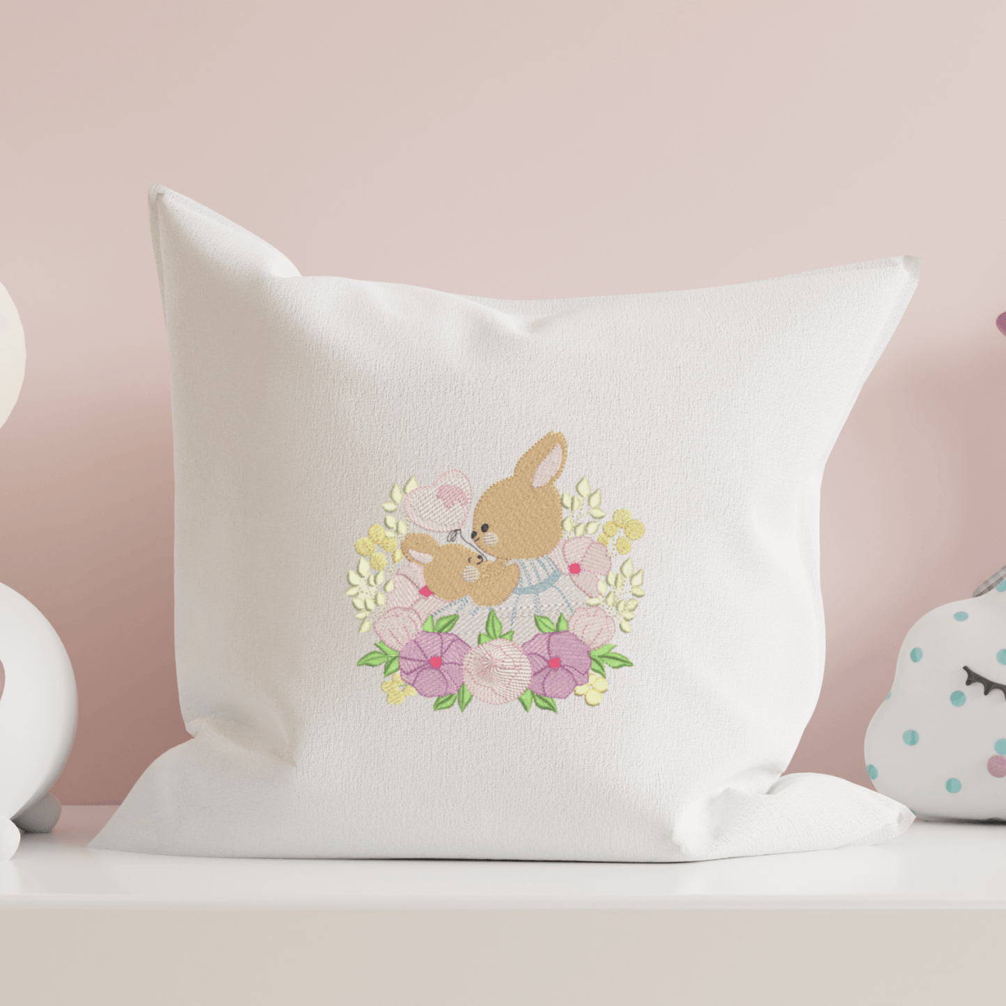 This is an image of a mommy bunny with a baby bunny holding a balloon, and surrounded by beautiful purple flowers machine embroidery design.