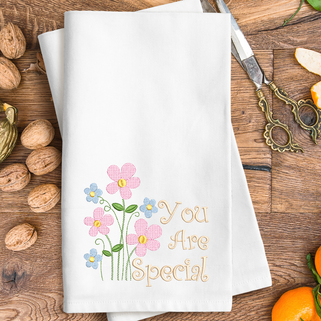 This is an image of a machine embroidery design from Stitches & Strokes, featuring cute field flowers, and a "You Are Special Quote." This "You are Special Quote machine embroidery design is perfect for embroidery on gifts for mom on Mother's Day.